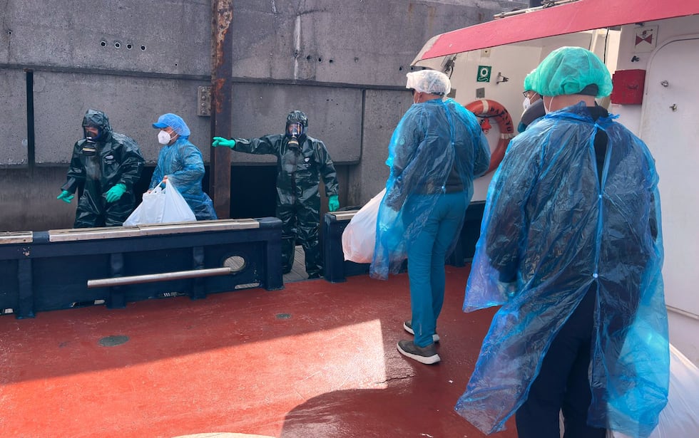 Passengers are disembarked from the hantavirus-stricken cruise ship MV Hondius at the port of...
