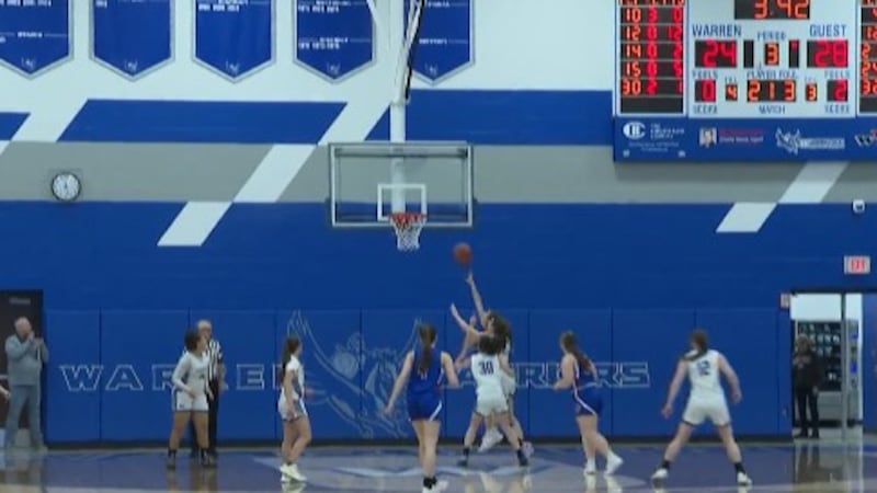 Khoen Courson makes a lay-up to extend Fort Frye's lead in their 45-31 victory against Warren...