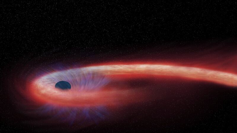 This artist rendering provided by NASA shows a star being swallowed by a black hole, and...